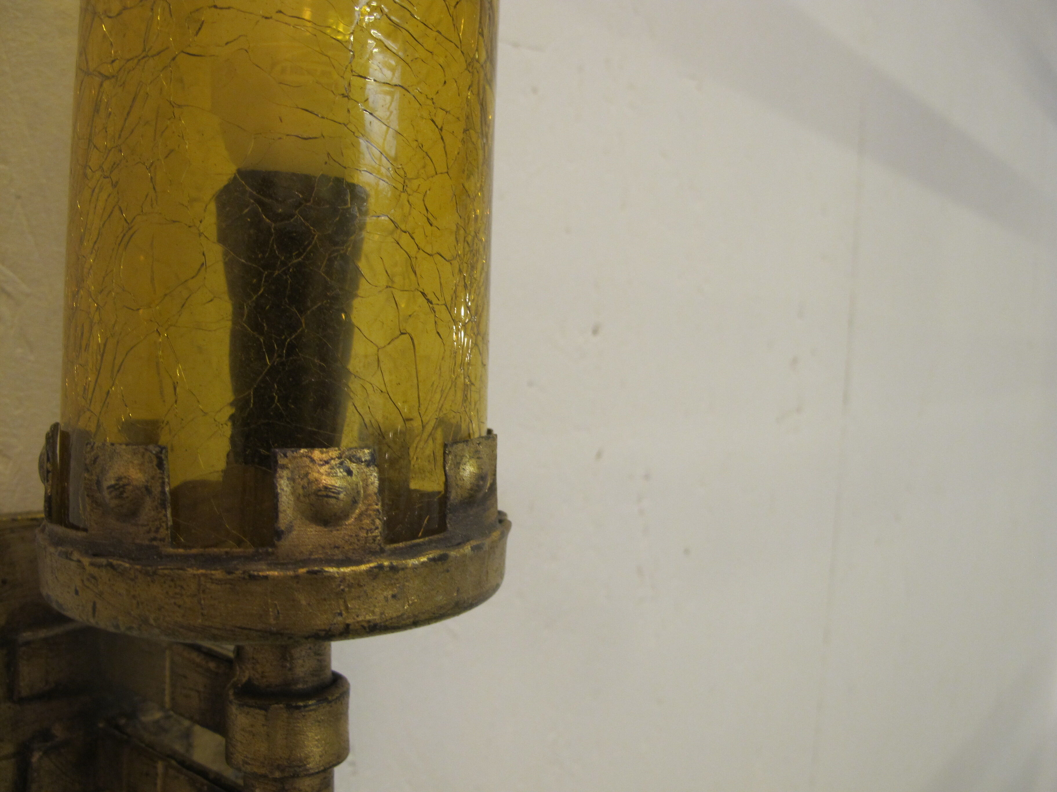 Pair of wall sconces, folded metal and yellow "shattered" glass