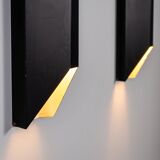 Architectural pair of vintage black metal wall lamps with angular geometric