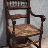 Renaissance-style armchair in solid wood, featuring a columned back