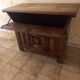 Old solid wood dough mixer carefully transformed into a bar cabinet.