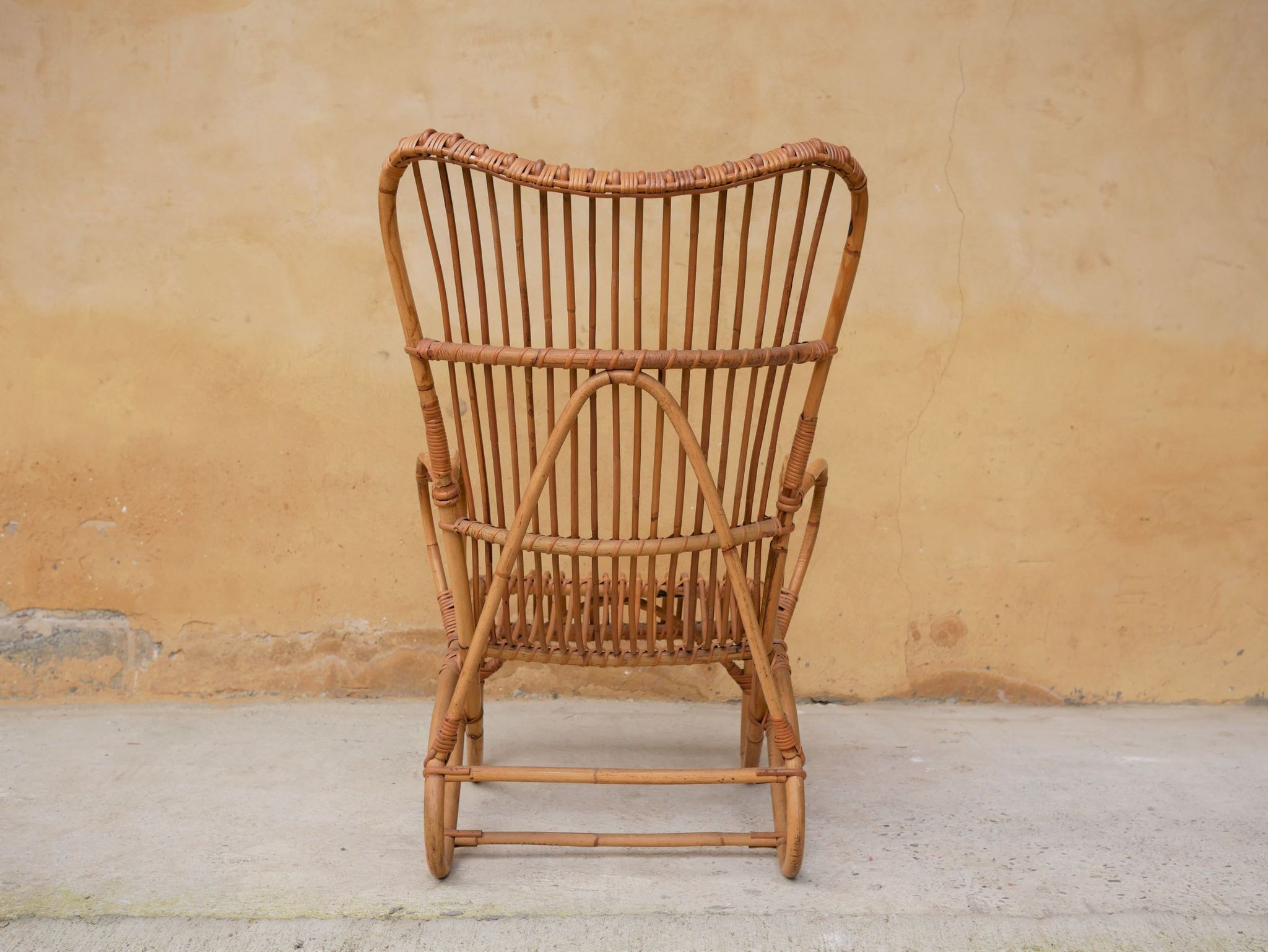 Vintage rattan chair by Louis Sognot