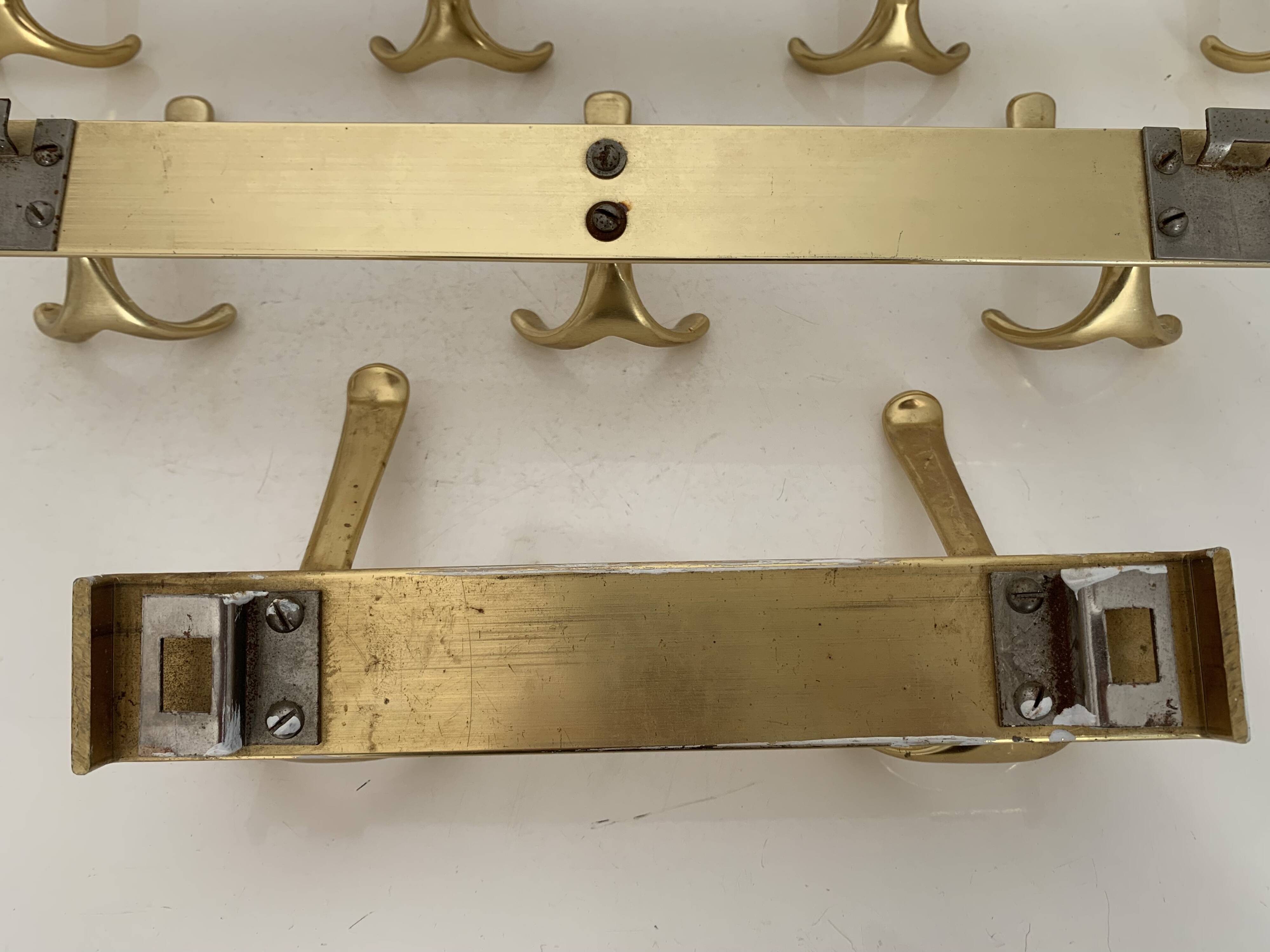 Three vintage 1960s gold coat racks with 4, 3 and 2 hooks