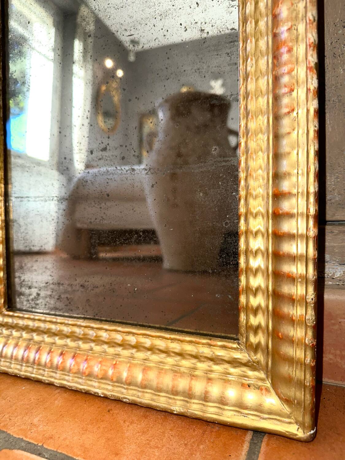 Antique gilded mirror from the Directoire period, 19th century.