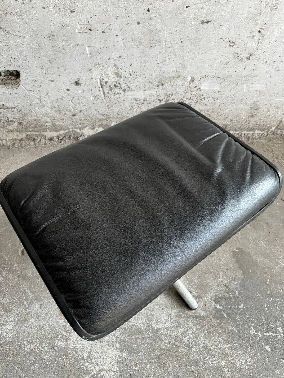 Wilkhahn Delta lounge chair in black leather with polished aluminum base and footrest (1970s)