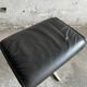 Wilkhahn Delta lounge chair in black leather with polished aluminum base and footrest (1970s)