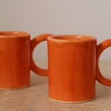 Handmade orange peach ceramic coffee mug set with large circular handles