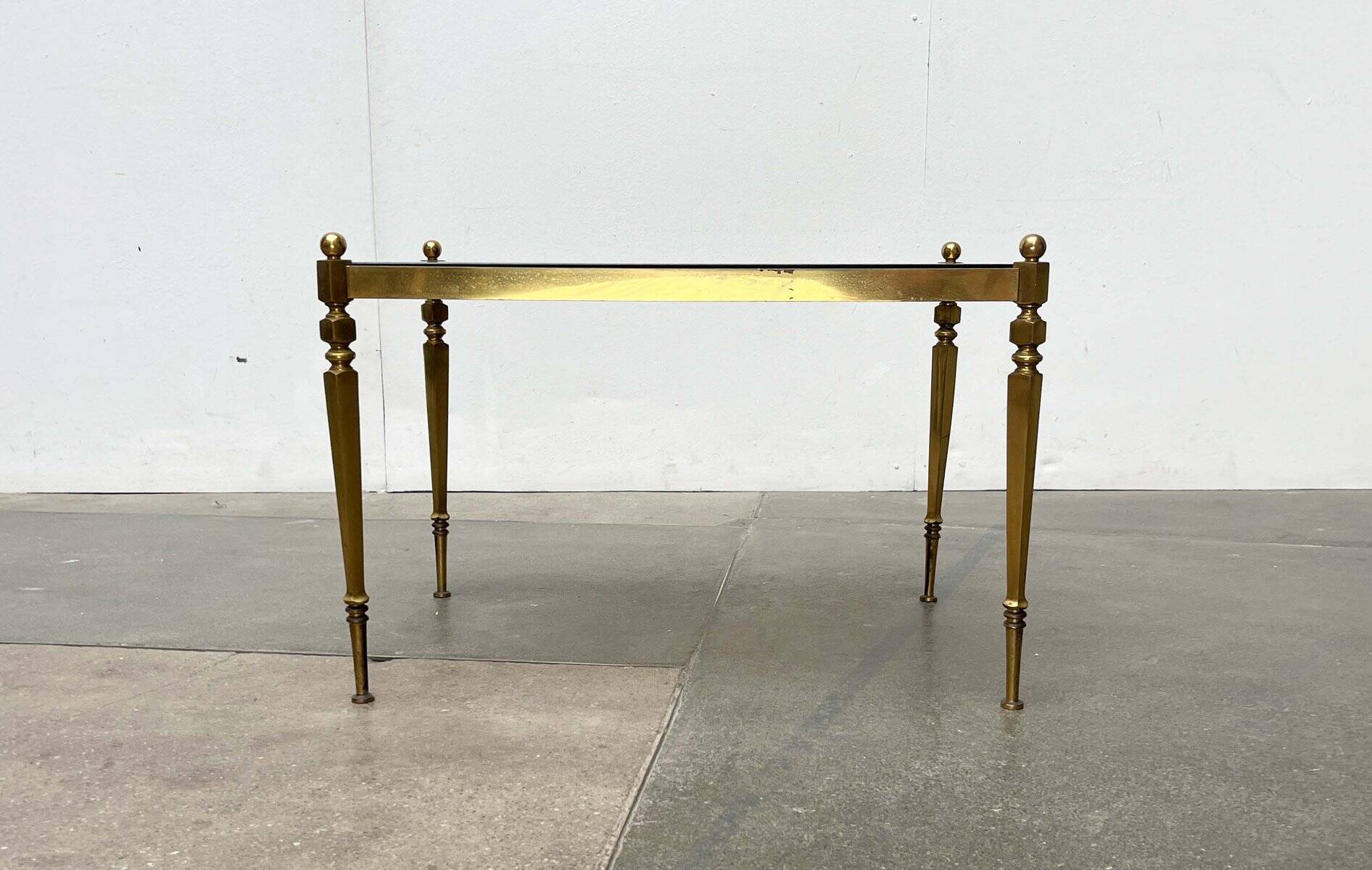 Mid-century German Hollywood neoclassical brass and glass side table from the 1950s.