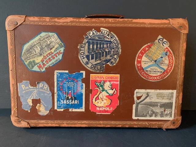 Old travel suitcase and legendary stickers, 1920