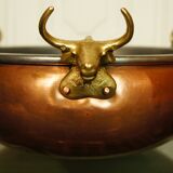 Copper cauldron with golden bronze bull heads