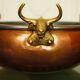 Copper cauldron with golden bronze bull heads