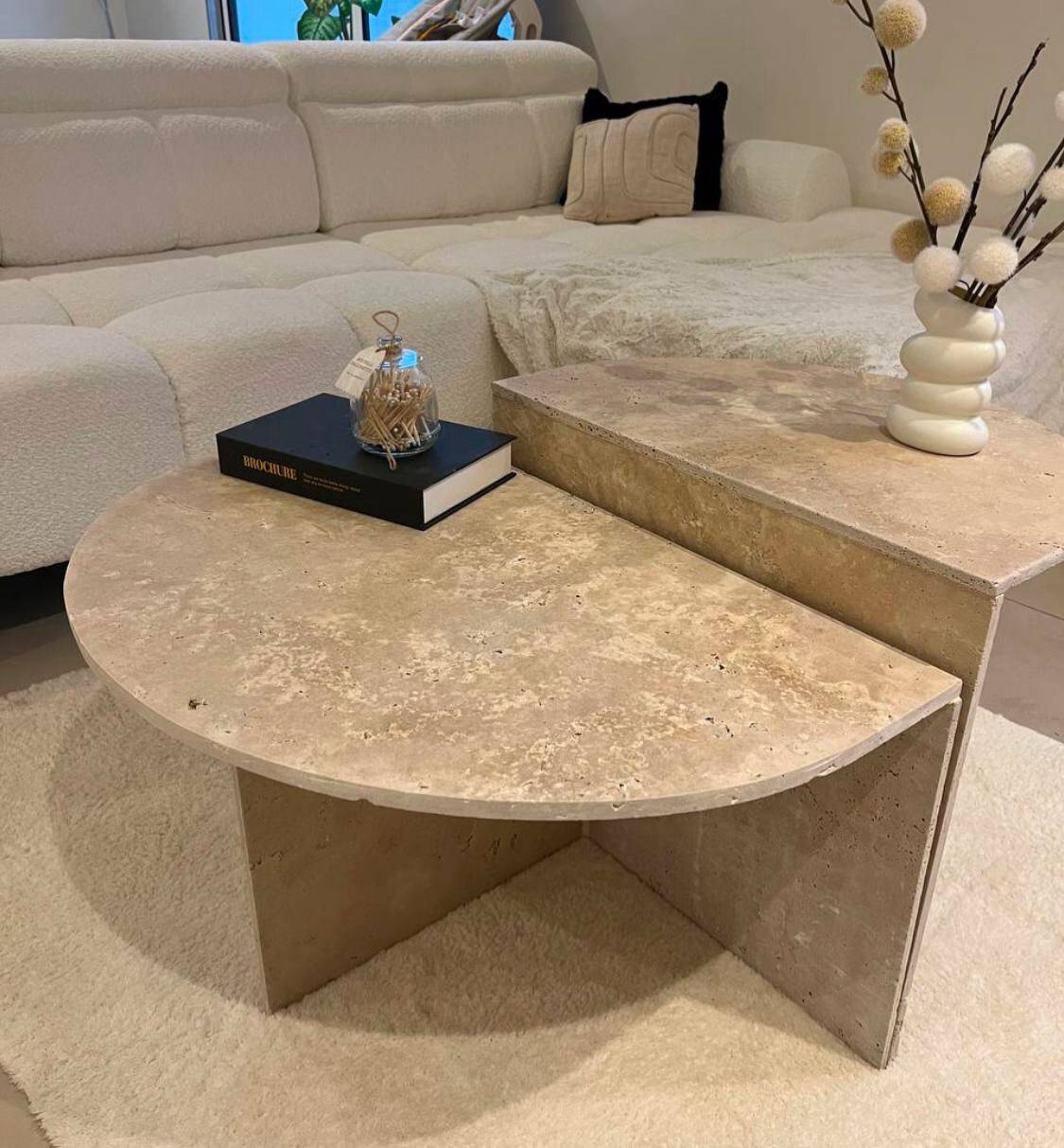 Half-moon travertine coffee table
