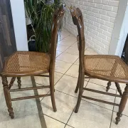 Pair of antique caned and wooden chairs from the 1900s.
