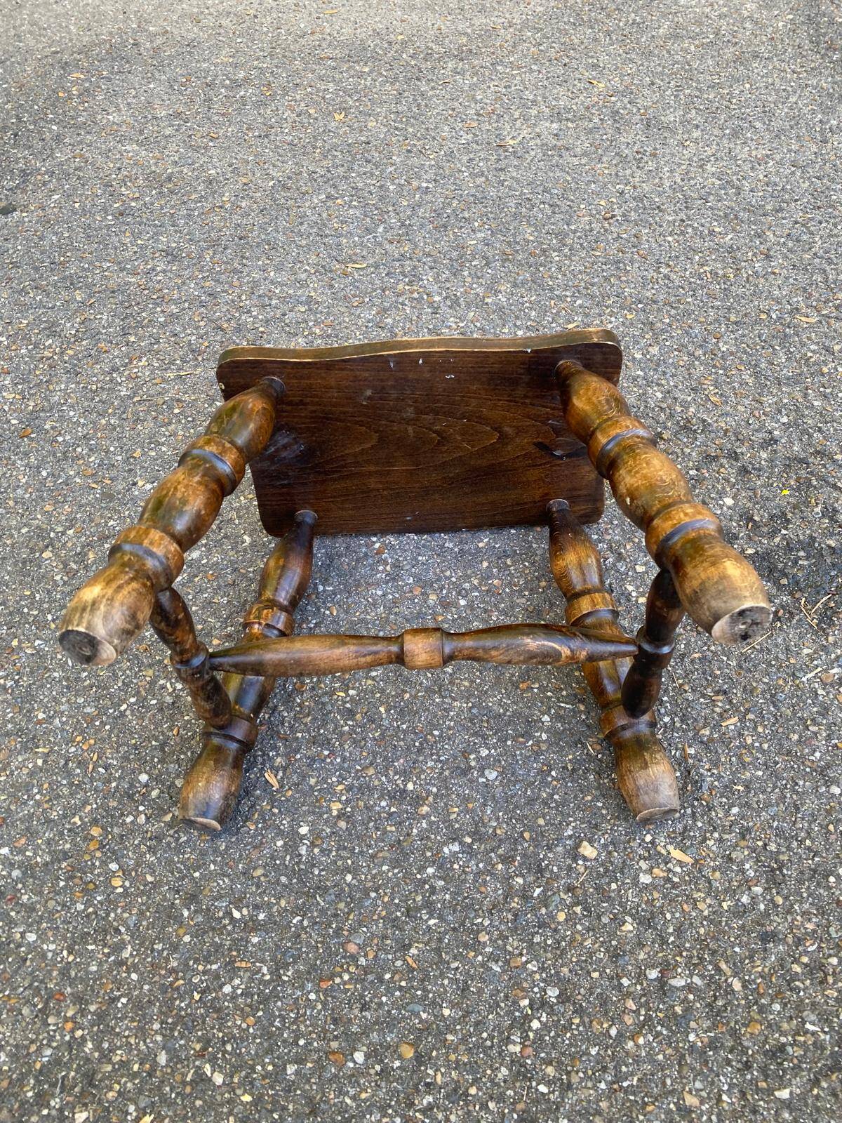 Small vintage low stool made of turned solid wood footrest 1960