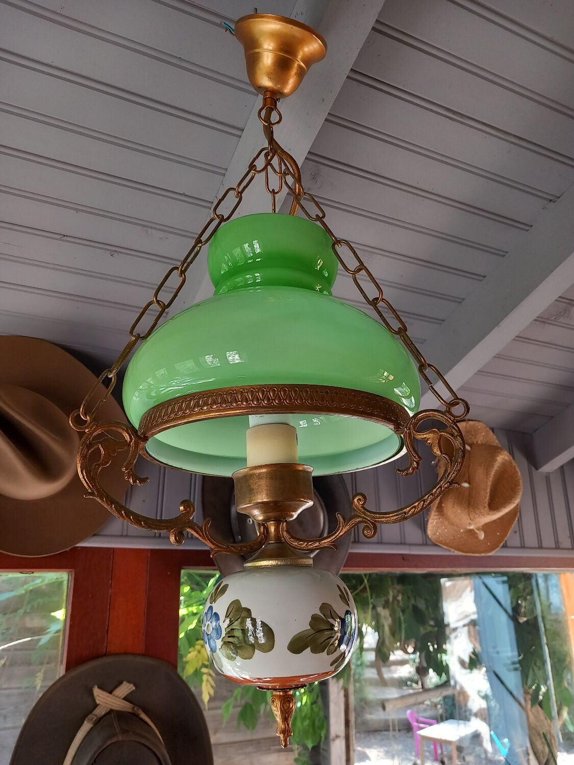 Old green opaline chandelier, gold metal and earthenware