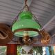 Old green opaline chandelier, gold metal and earthenware