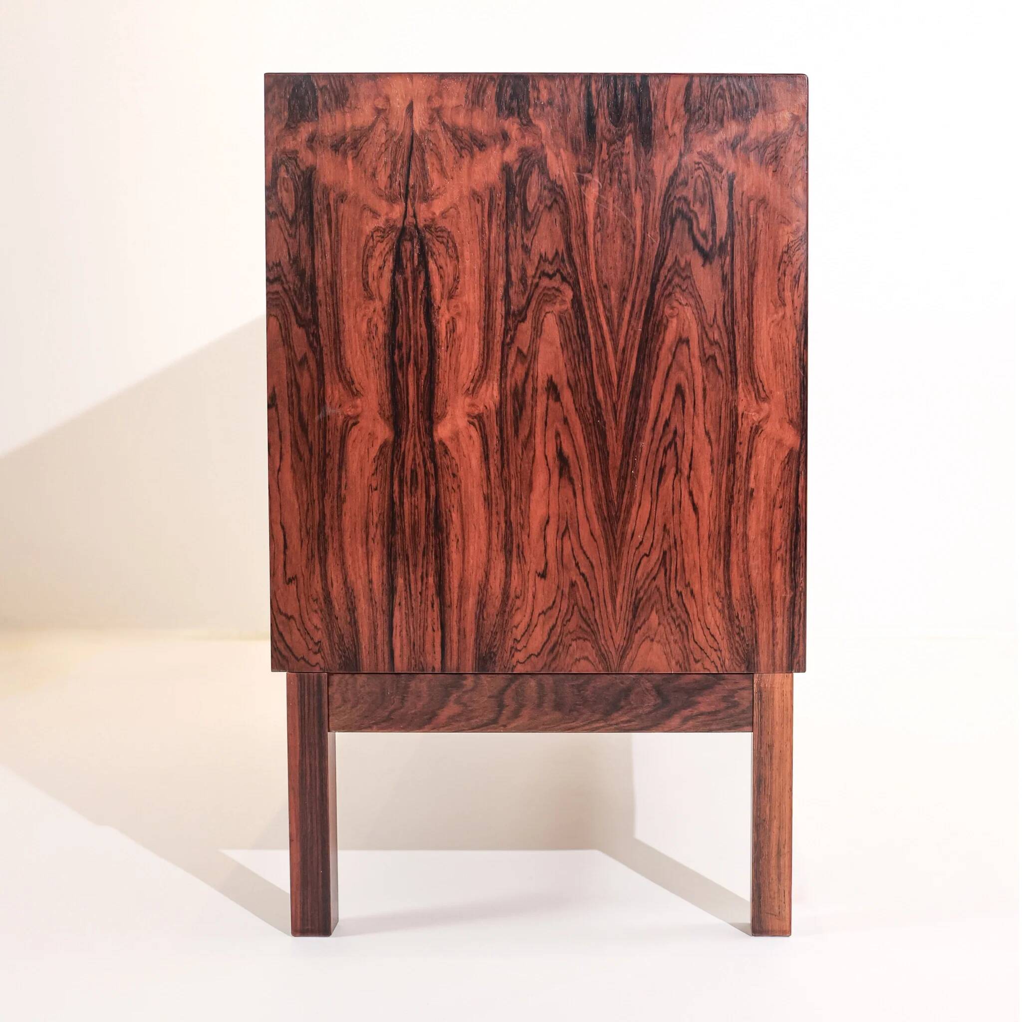 Vintage Swedish commode in rosewood with brass handles.