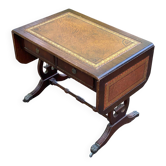 Victorian English extendable coffee table made of solid mahogany and leather.