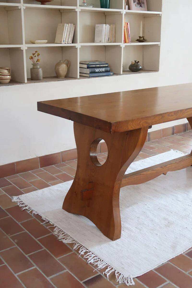 Solid wood dining table, sculpted brutalist base, 1960s.