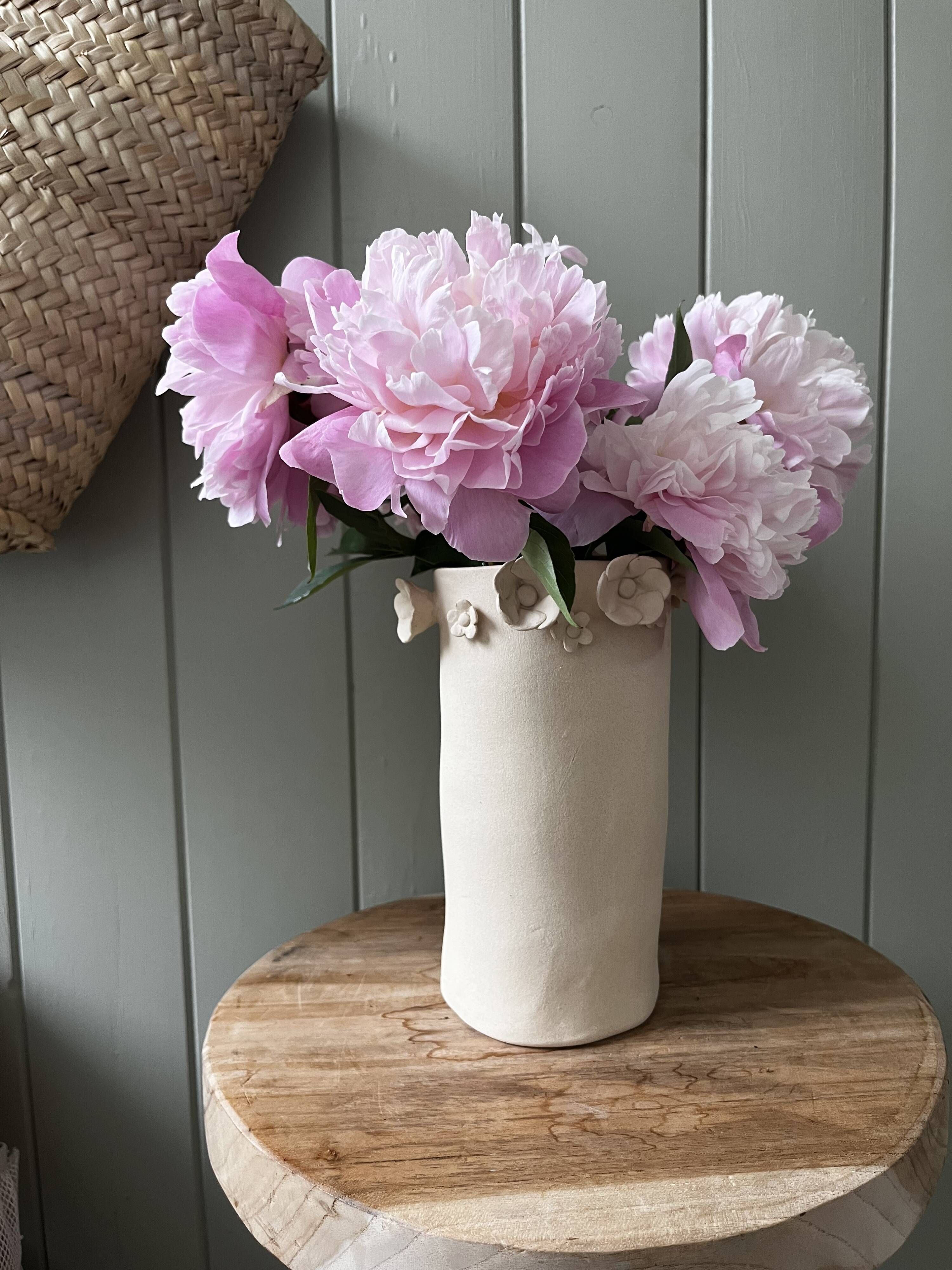 Stoneware vase with relief flowers