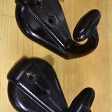 Pair of brown bakelite school hooks from 1957