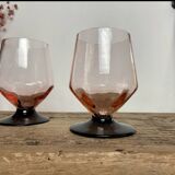 4 pink glasses with black stems