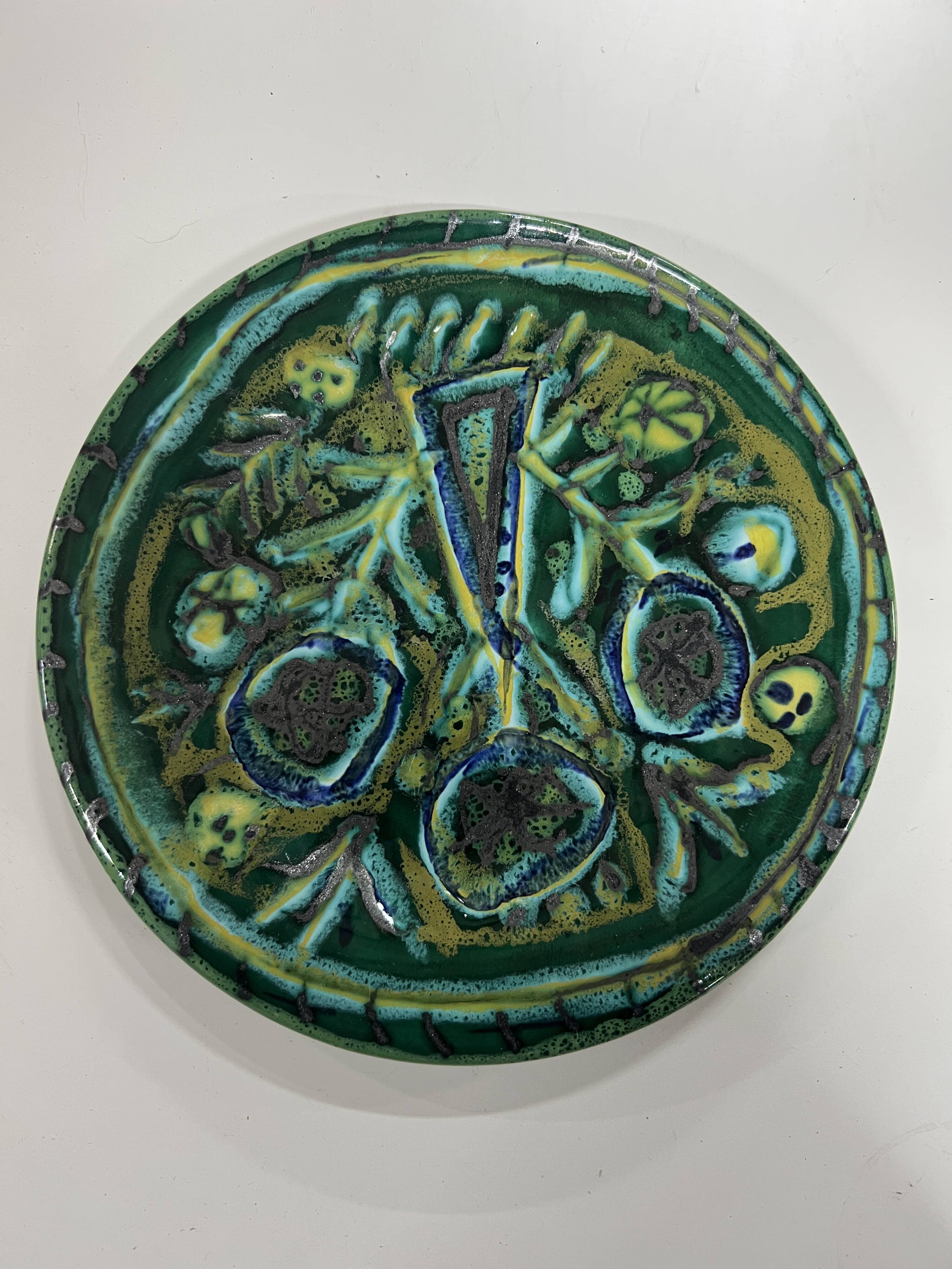 Ceramic plate signed Paul Yvain