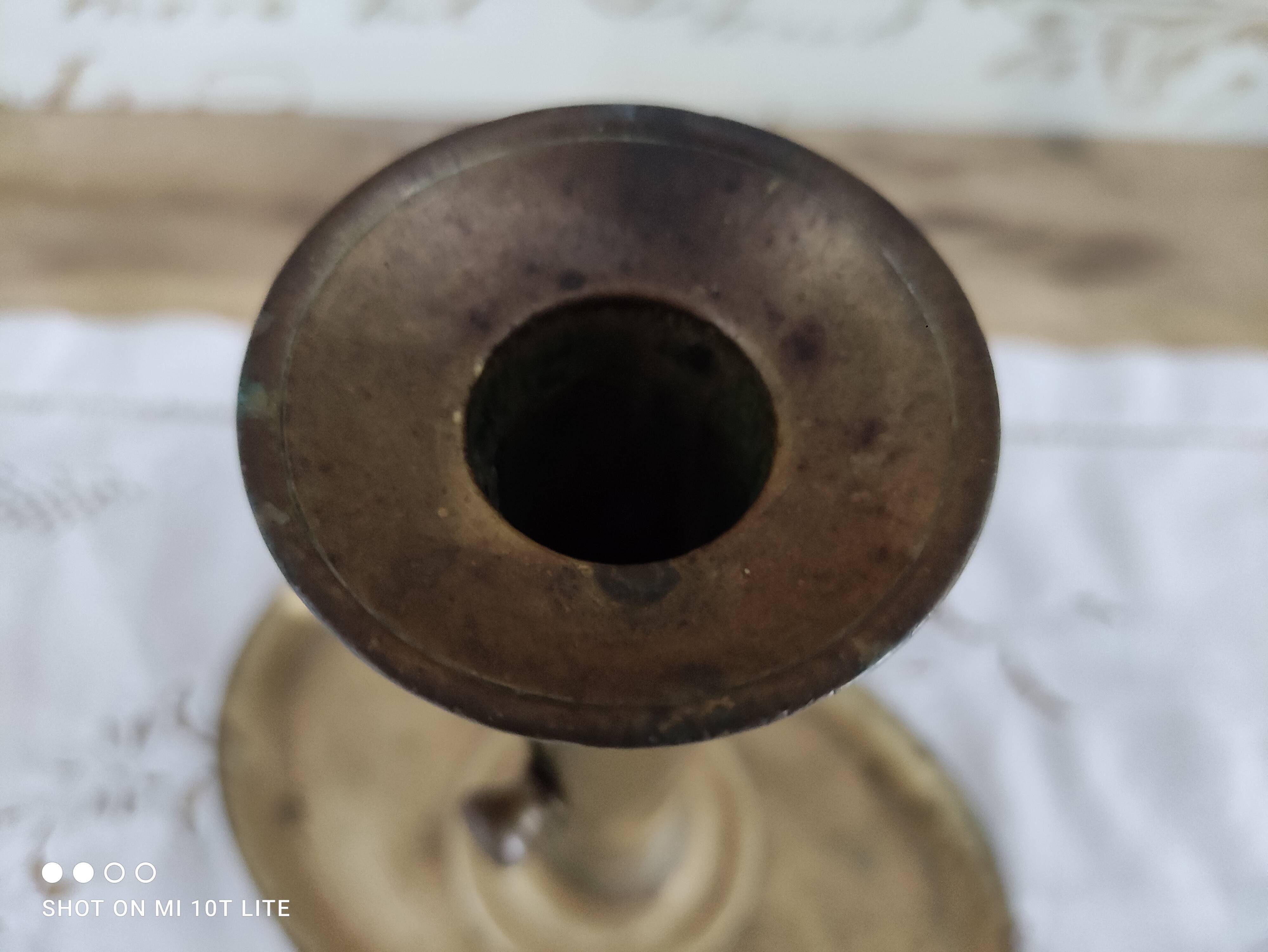 Brass pusher candle holder on oval frame