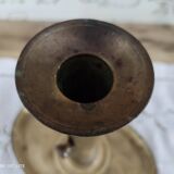 Brass pusher candle holder on oval frame
