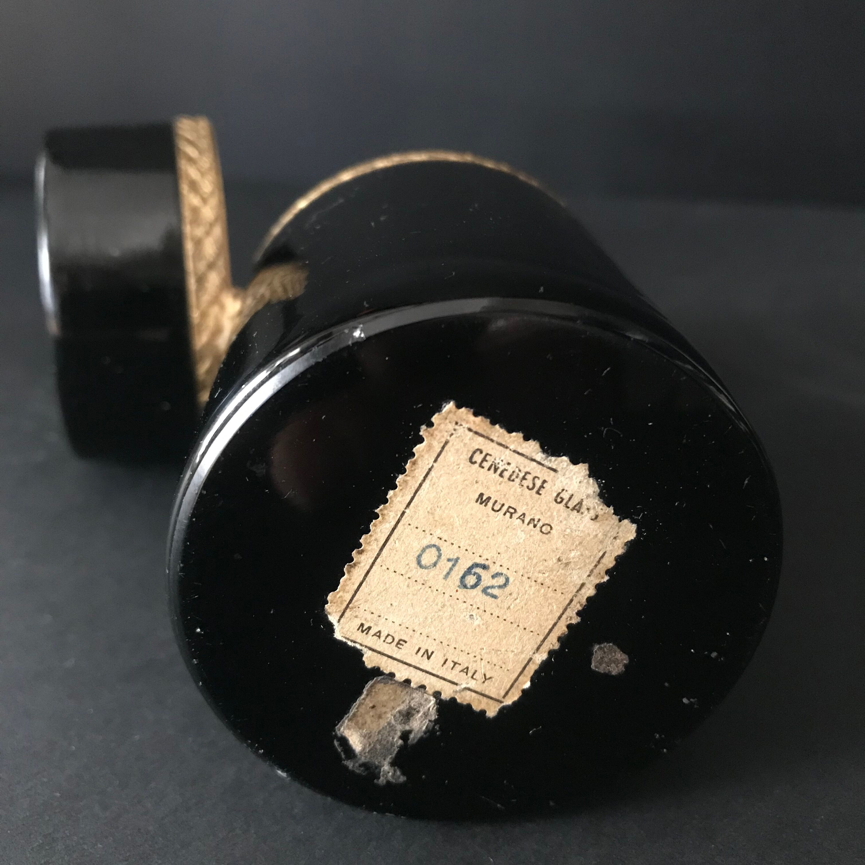 Black round box made of Murano glass