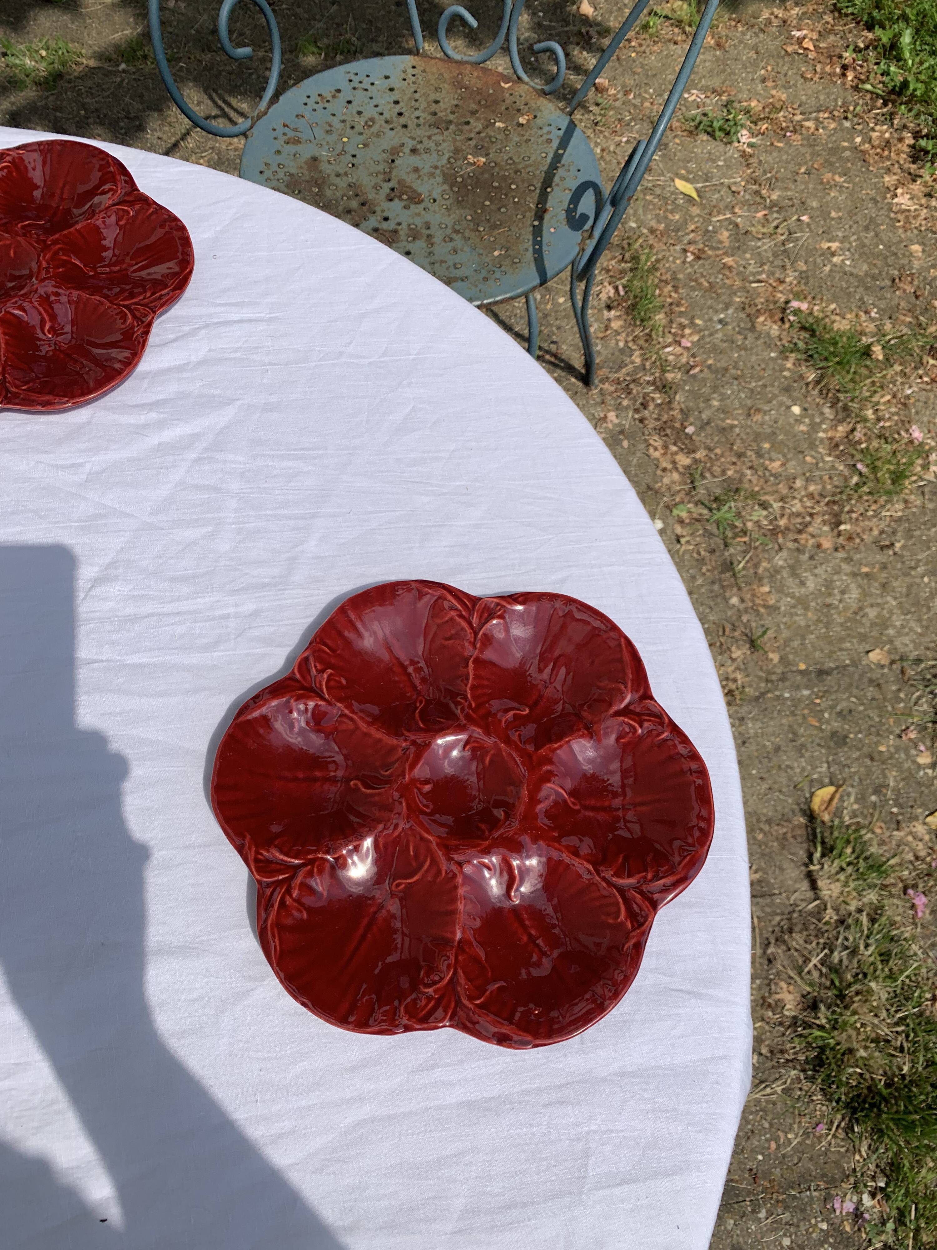 4 oyster plates in vintage red glazed ceramic slip and collector