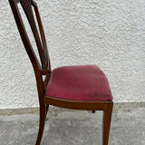 Set of 6 wooden chairs sitting red