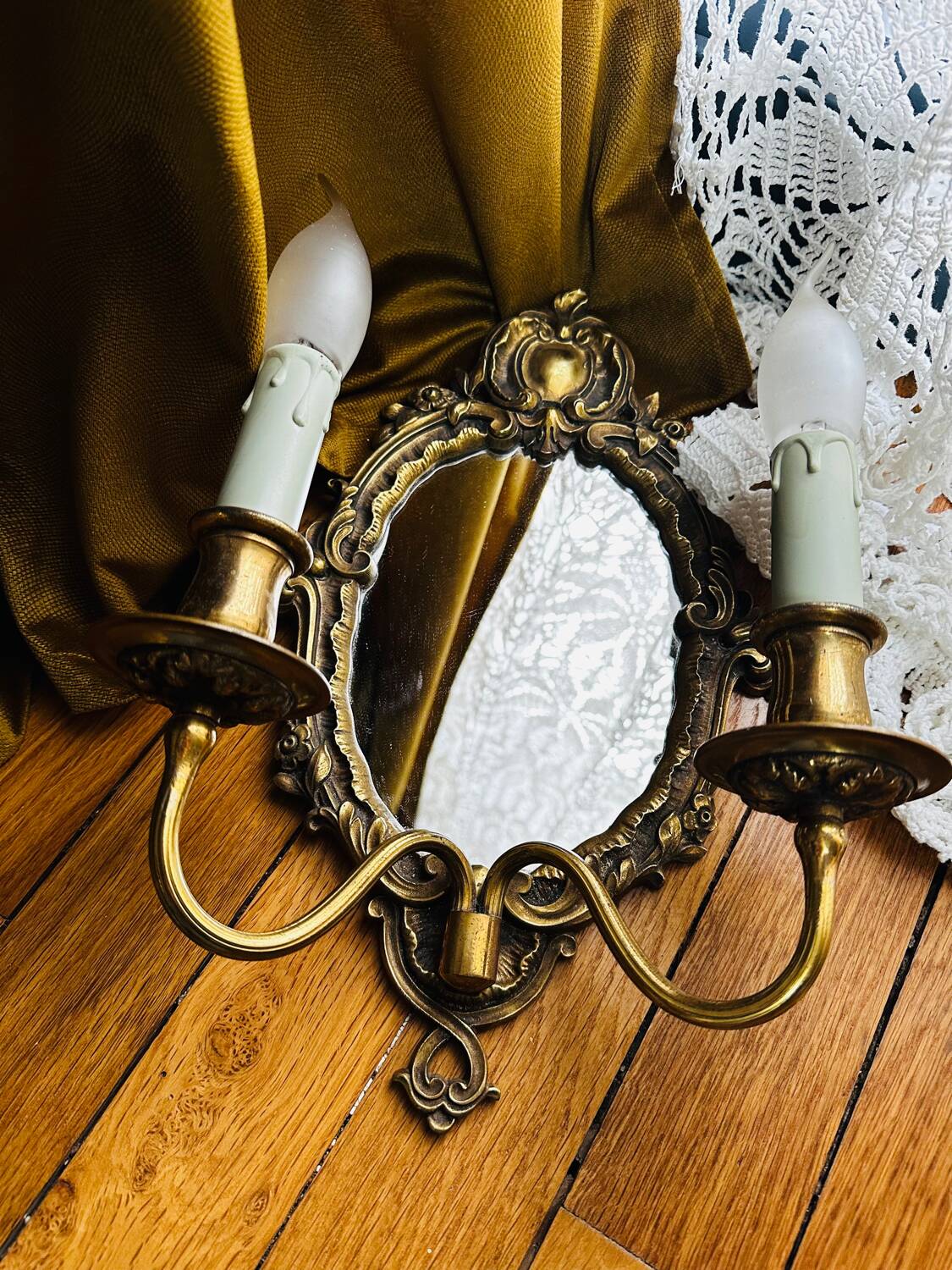 Antique bronze mirror wall sconce