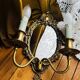 Antique bronze mirror wall sconce