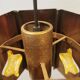 Older hanging lamp, made of metal with yellow prisms.