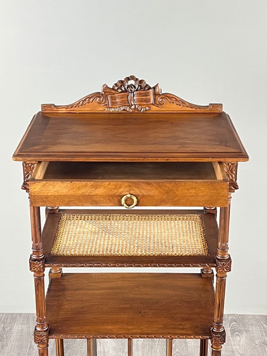 Louis XVI style music cabinet in carved wood with caning, 19th century.