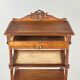 Louis XVI style music cabinet in carved wood with caning, 19th century.