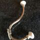 Brass and porcelain hook