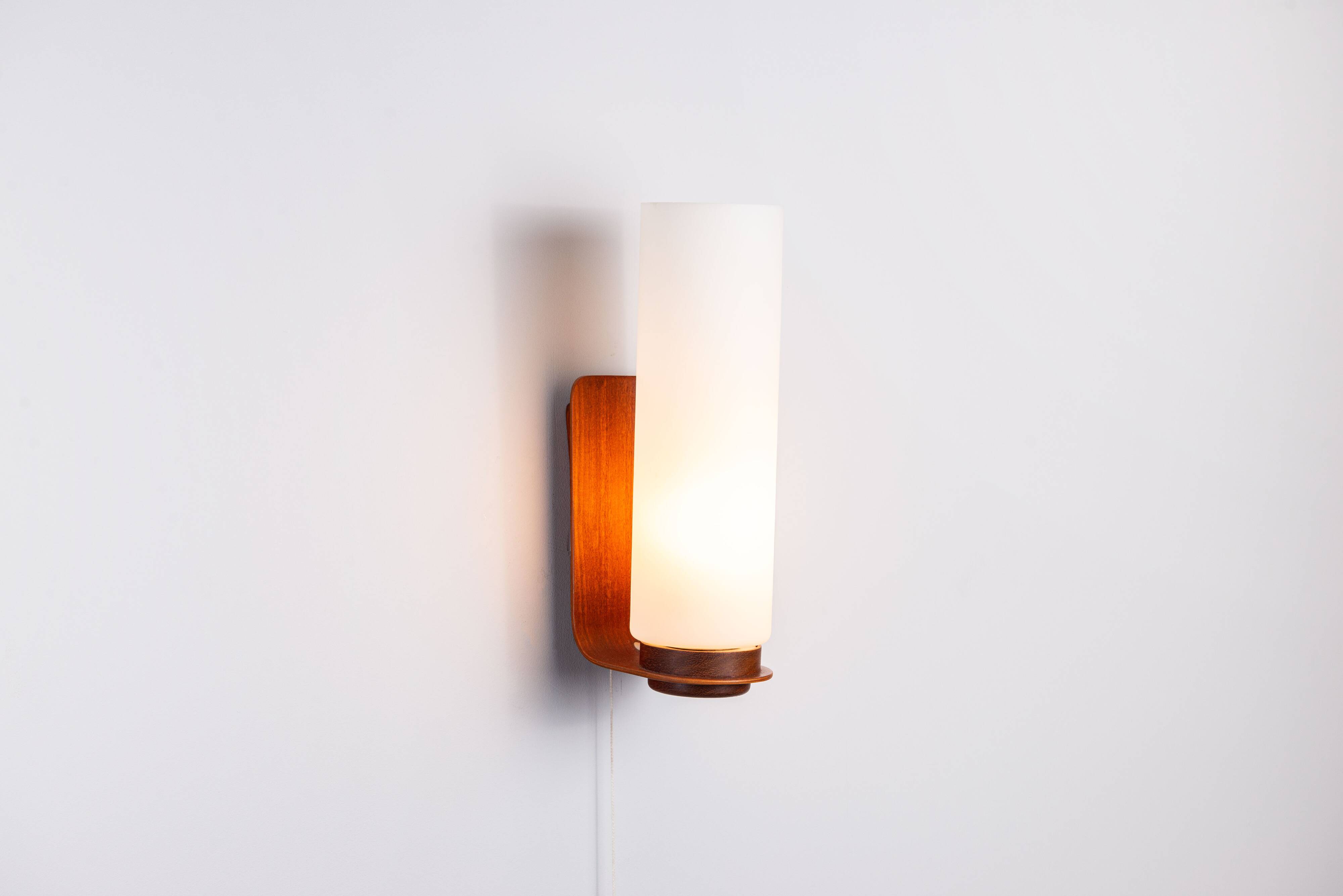 Cilindrical opal glass and bent wood wall lamp