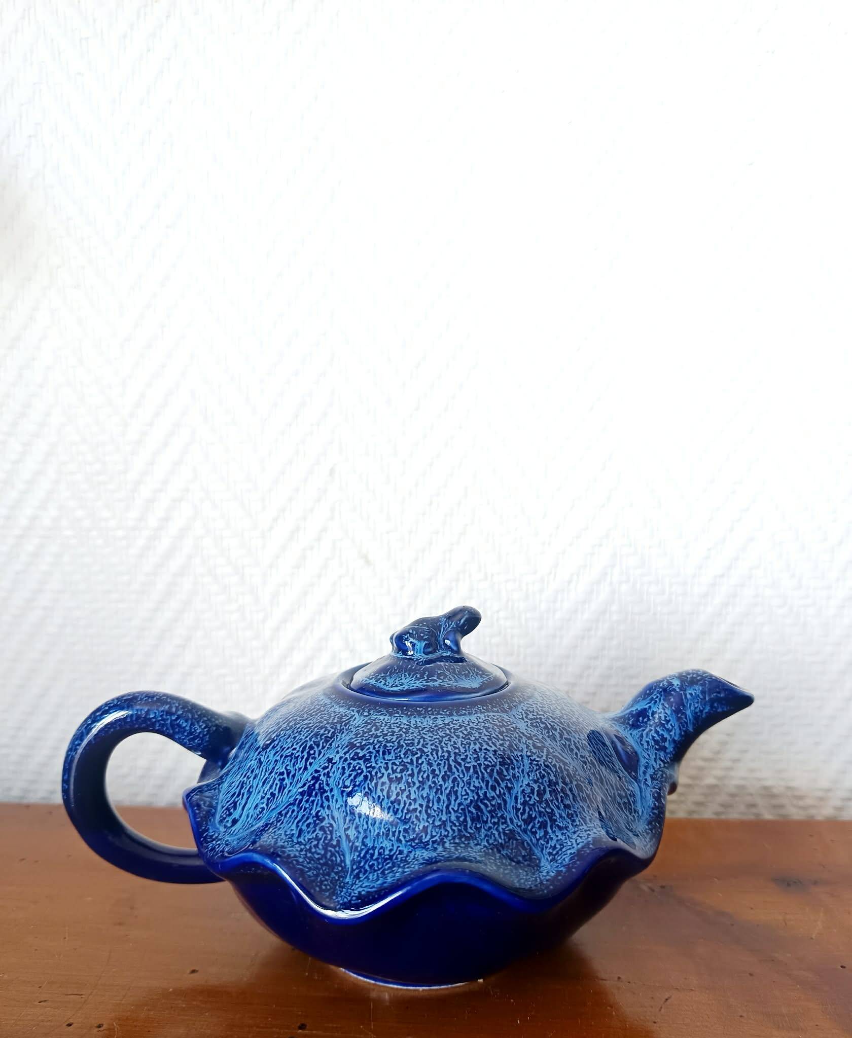 Blue ceramic Art Deco teapot with a frog.