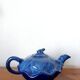 Blue ceramic Art Deco teapot with a frog.