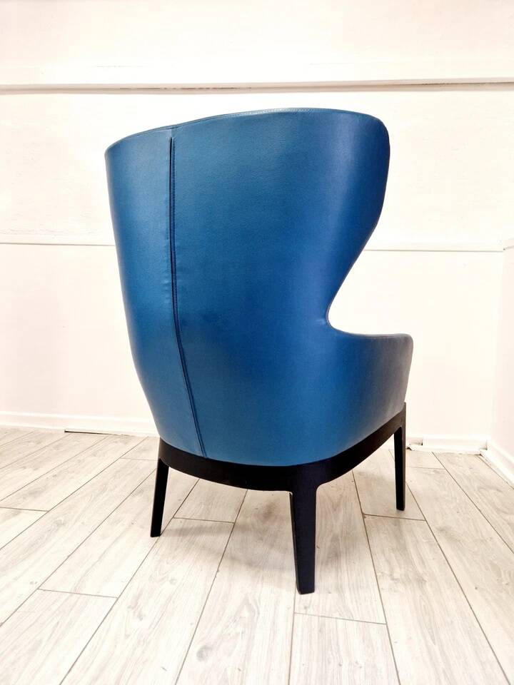 High-back armchair by Rodolfo Dordoni