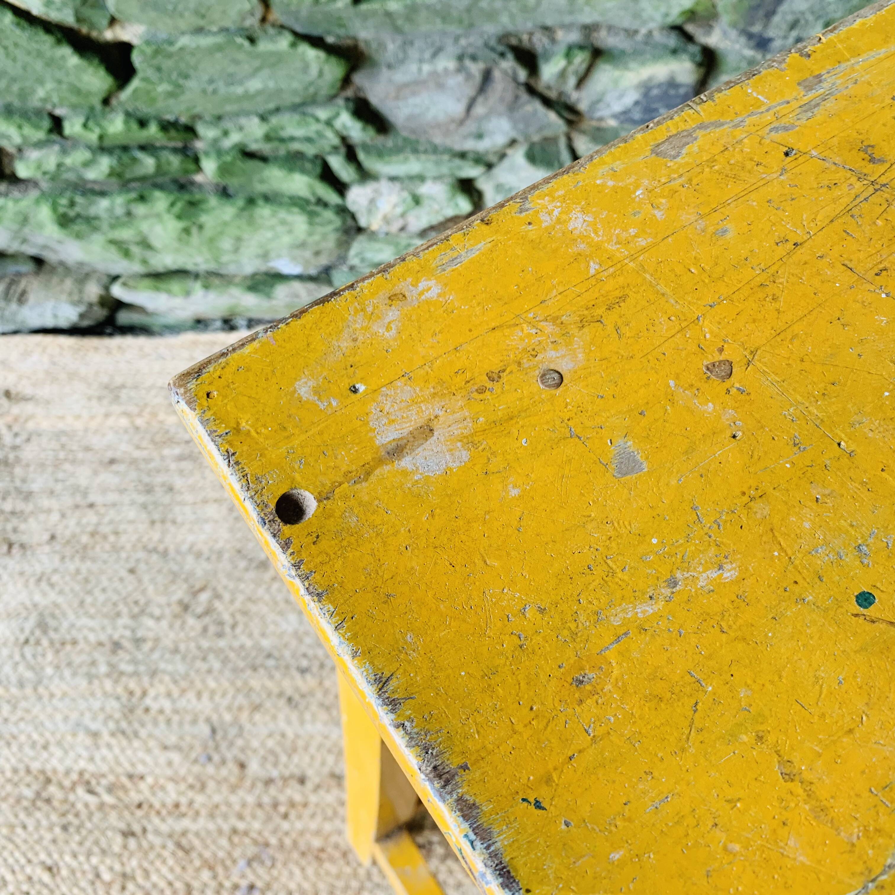 Yellow wooden high stool