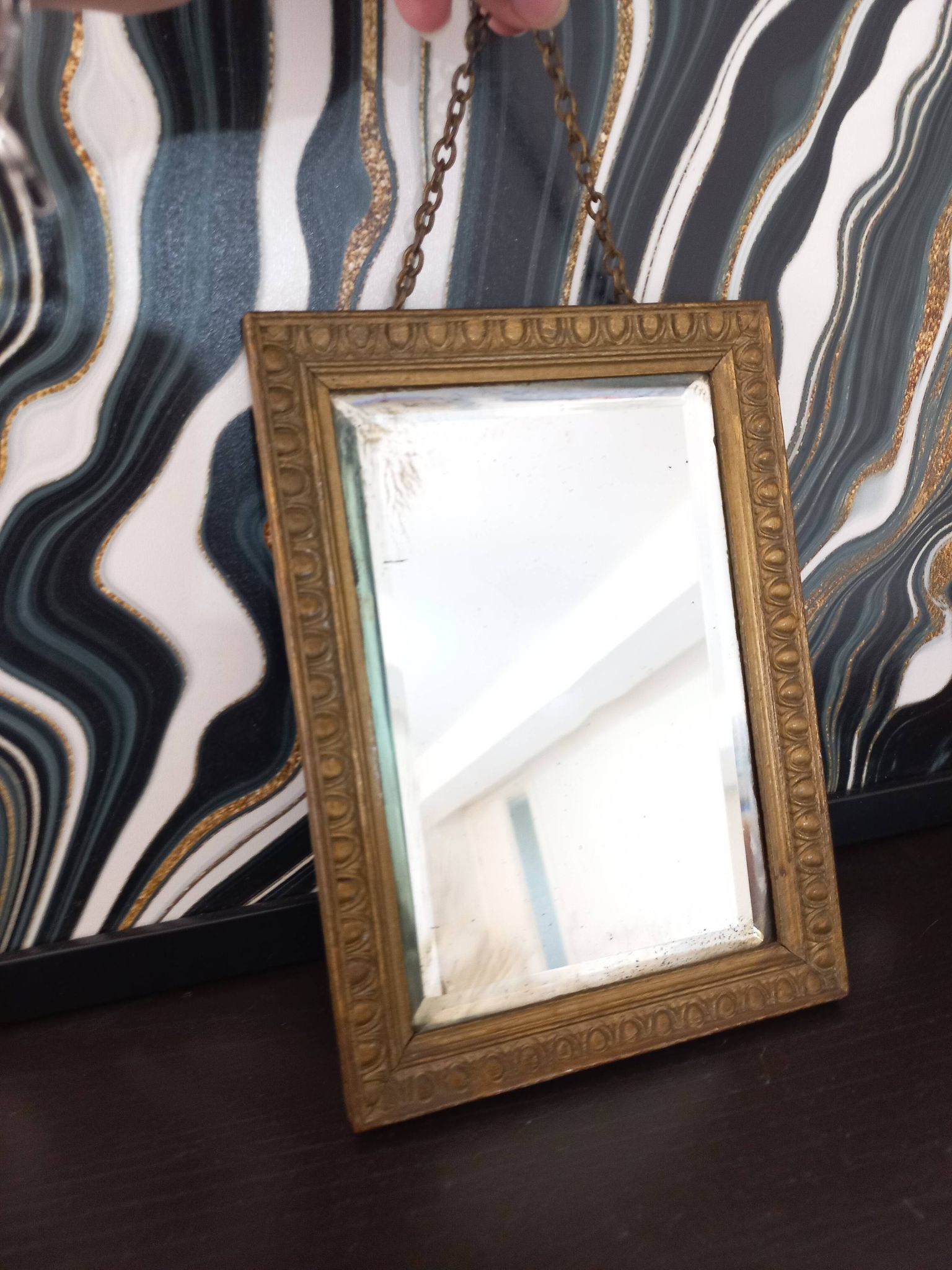 Small vintage mirror in gilded wood, bevelled glass with chain.