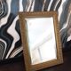Small vintage mirror in gilded wood, bevelled glass with chain.