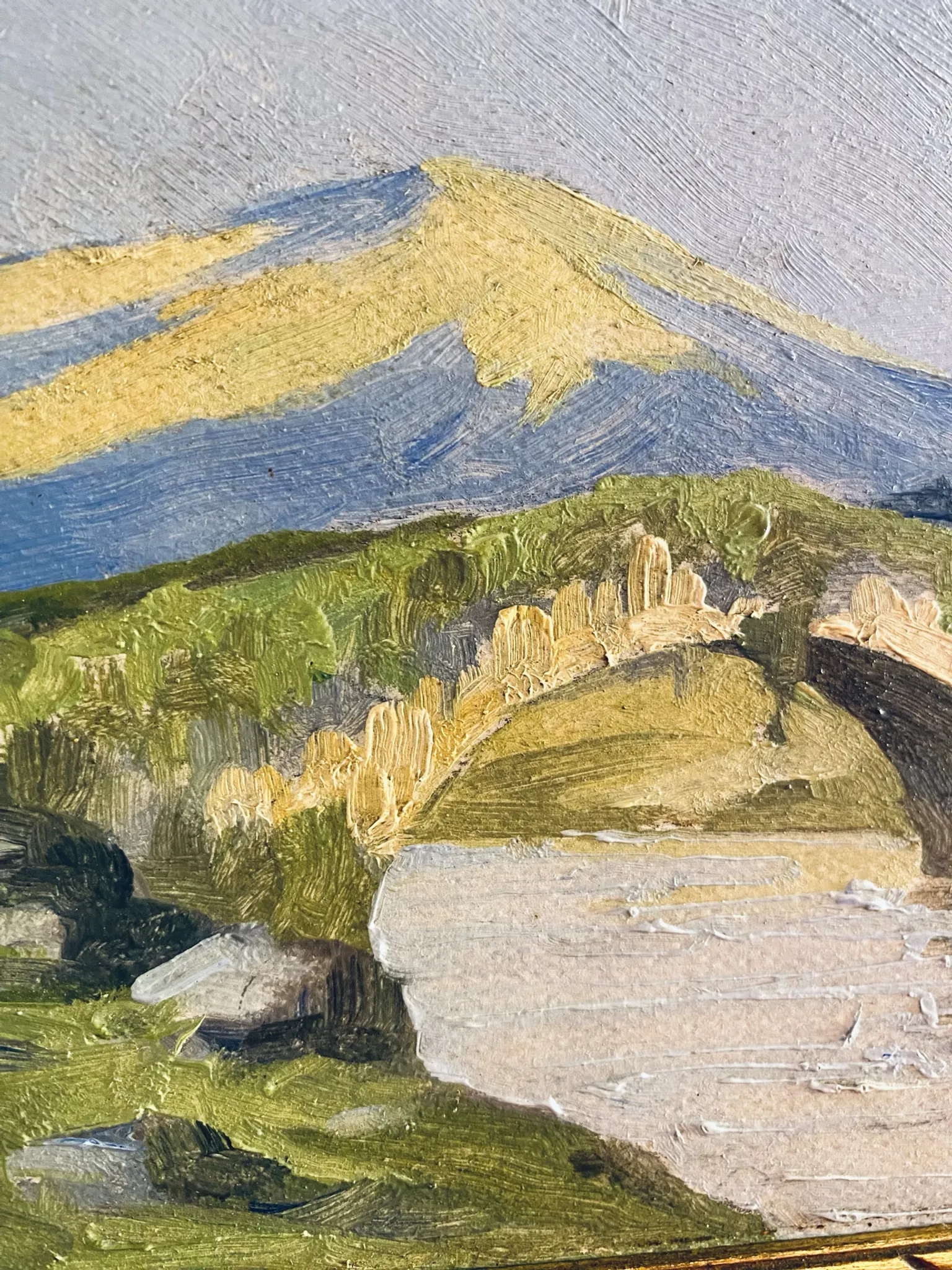 Small oil on panel of a countryside view from the early 20th century.