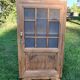 Armoire bonnetière vitrée
