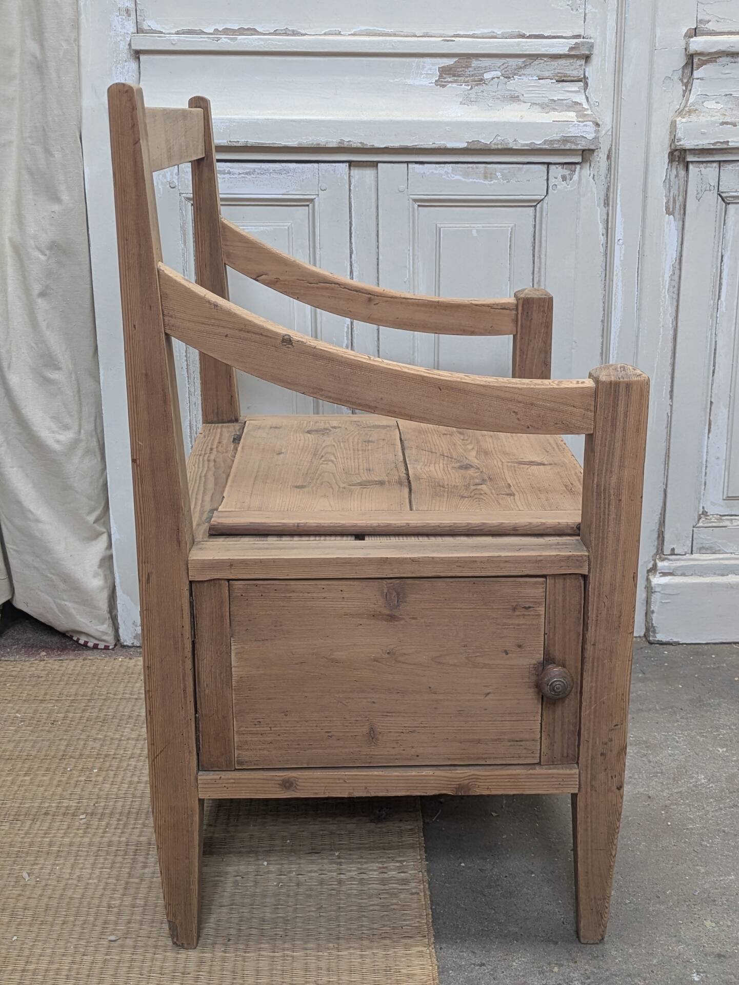 Antique armchair in raw wood