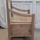 Antique armchair in raw wood