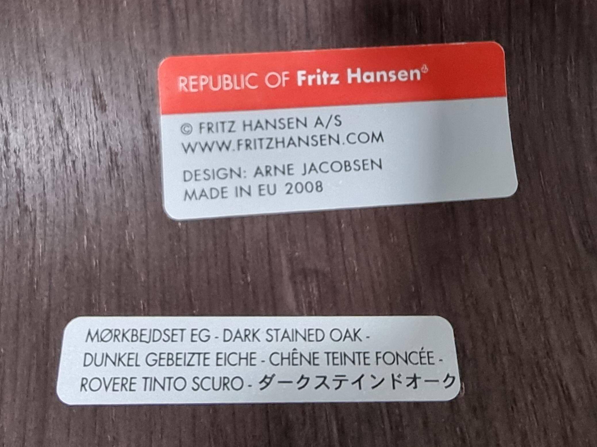 Set of 4 brown oak plywood bar stools by Fritz Hansen Series 7 by Arne Jacobsen.