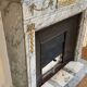 Louis XVI fireplace in veined grey marble with original gilded bronzes from the 19th century.